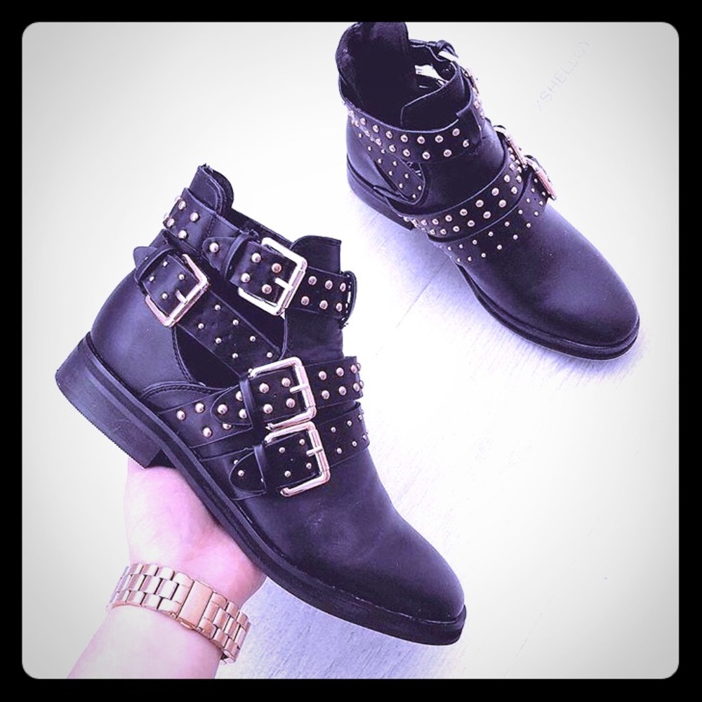 Ankle boots with gold buckles